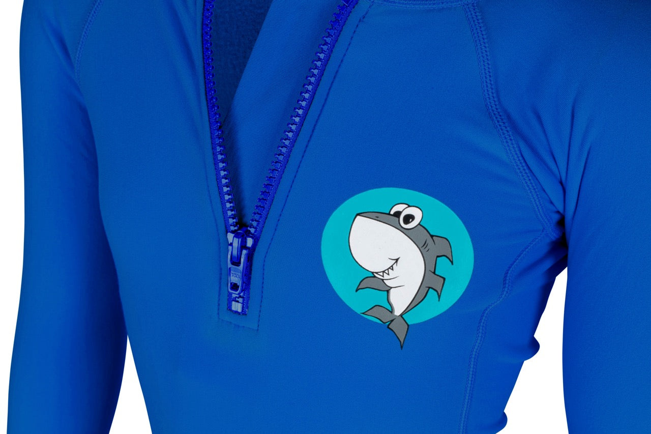 Side view — groms in Shark Eyes thermal rash vest in cold water — surfing