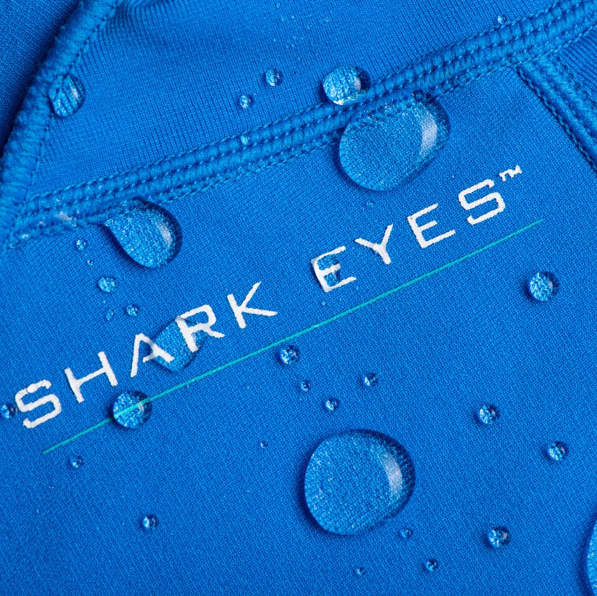 Groms wearing Shark Eyes thermal rash vest in cold water — surfing