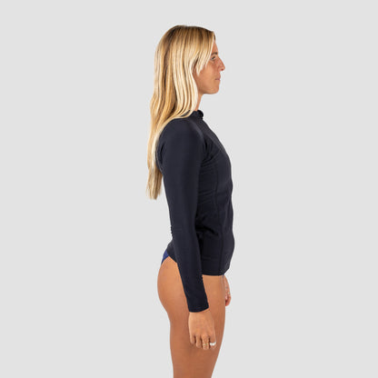 Woman wearing a black front zip long-sleeve rash vest on a gray background