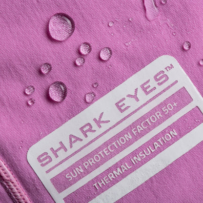 Groms wearing Shark Eyes thermal rash vest in cold water — surfing