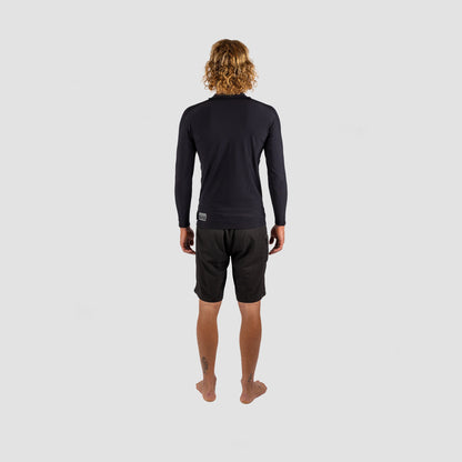 Mens in Shark Eyes thermal rash vest, back view — cold water surfing