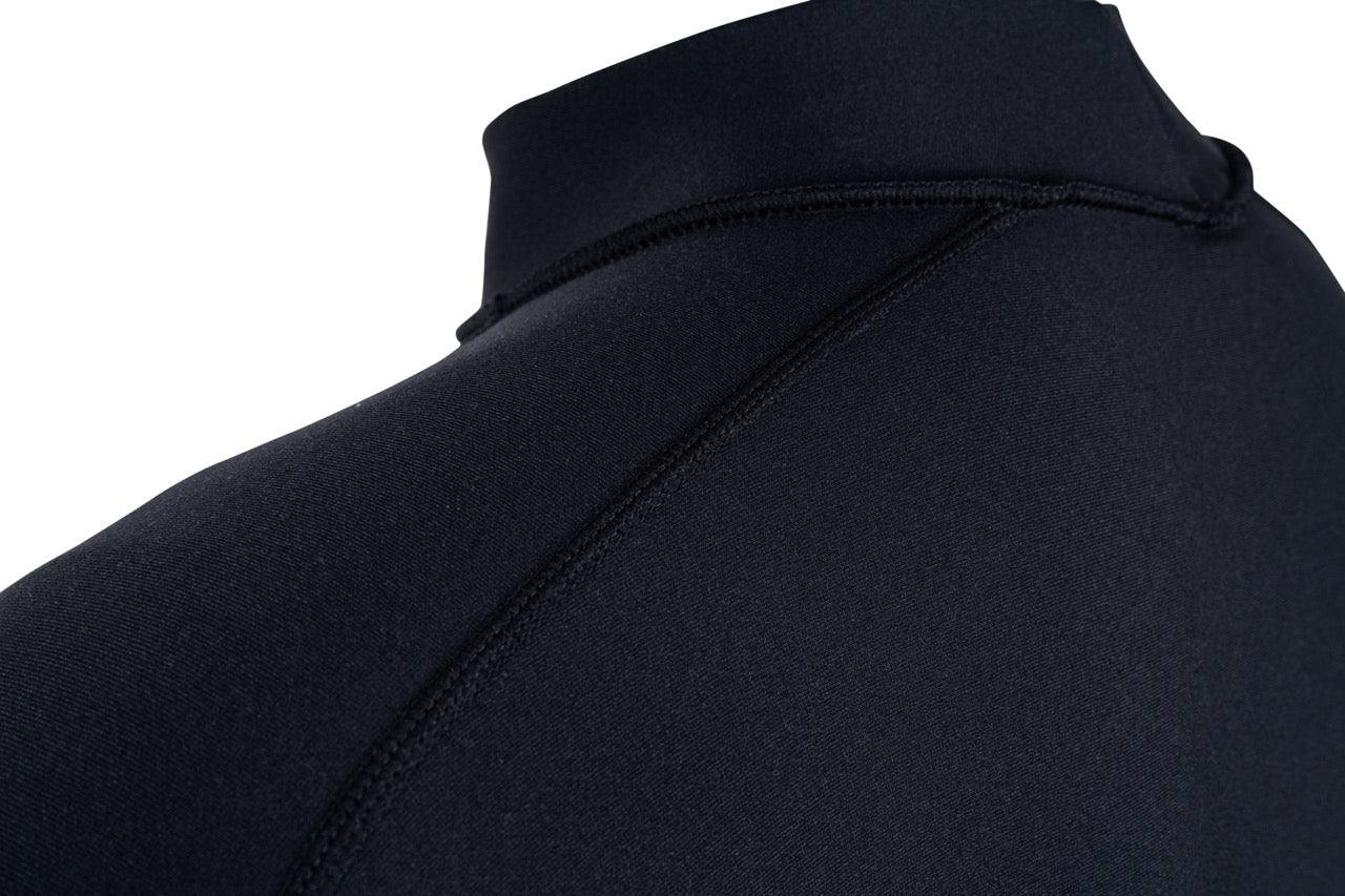 Action shot — mens in Shark Eyes thermal rash vest in cold water