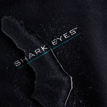 Mens wearing Shark Eyes thermal rash vest in cold water — surfing