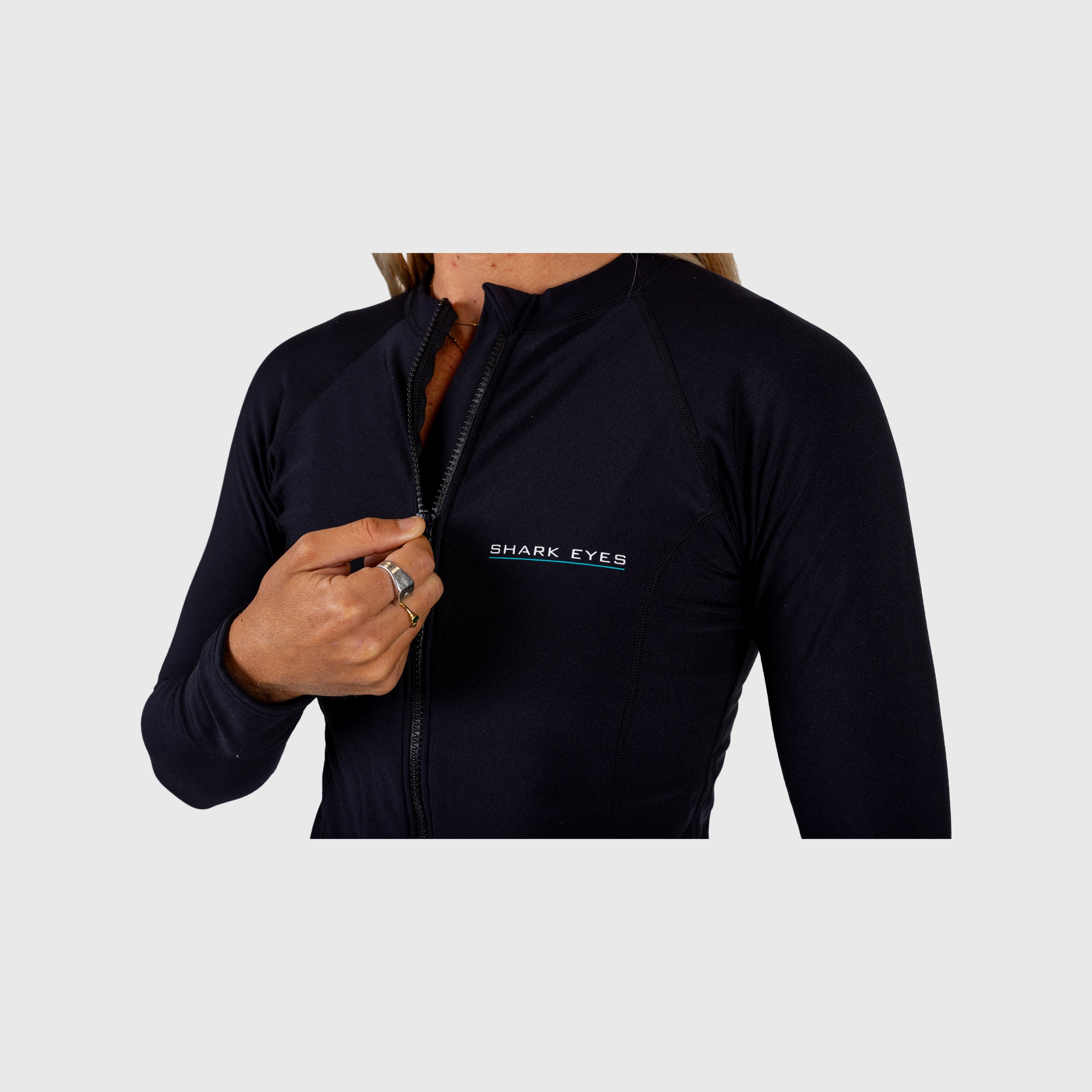 Close-up of thermal rash vest detail on Shark Eyes womens — quality rashie construction