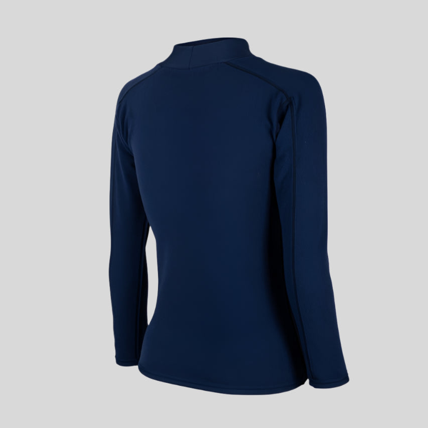 Side view — womens in Shark Eyes thermal rash vest in cold water — surfing