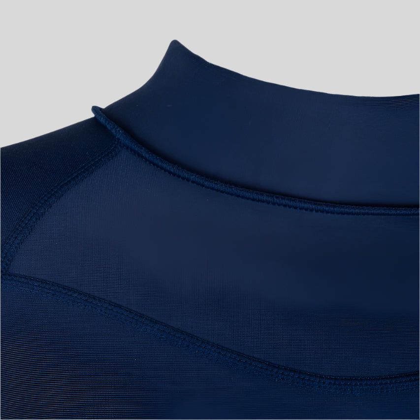 Shark Eyes womens thermal rash vest in use — cold water surfing rashie