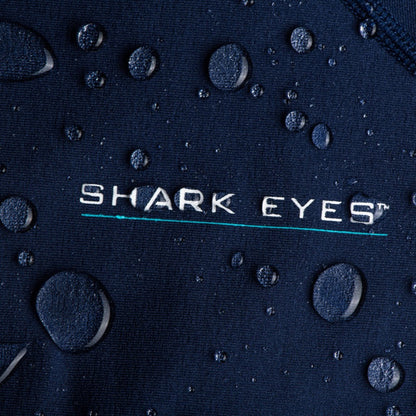 Womens wearing Shark Eyes thermal rash vest in cold water — surfing