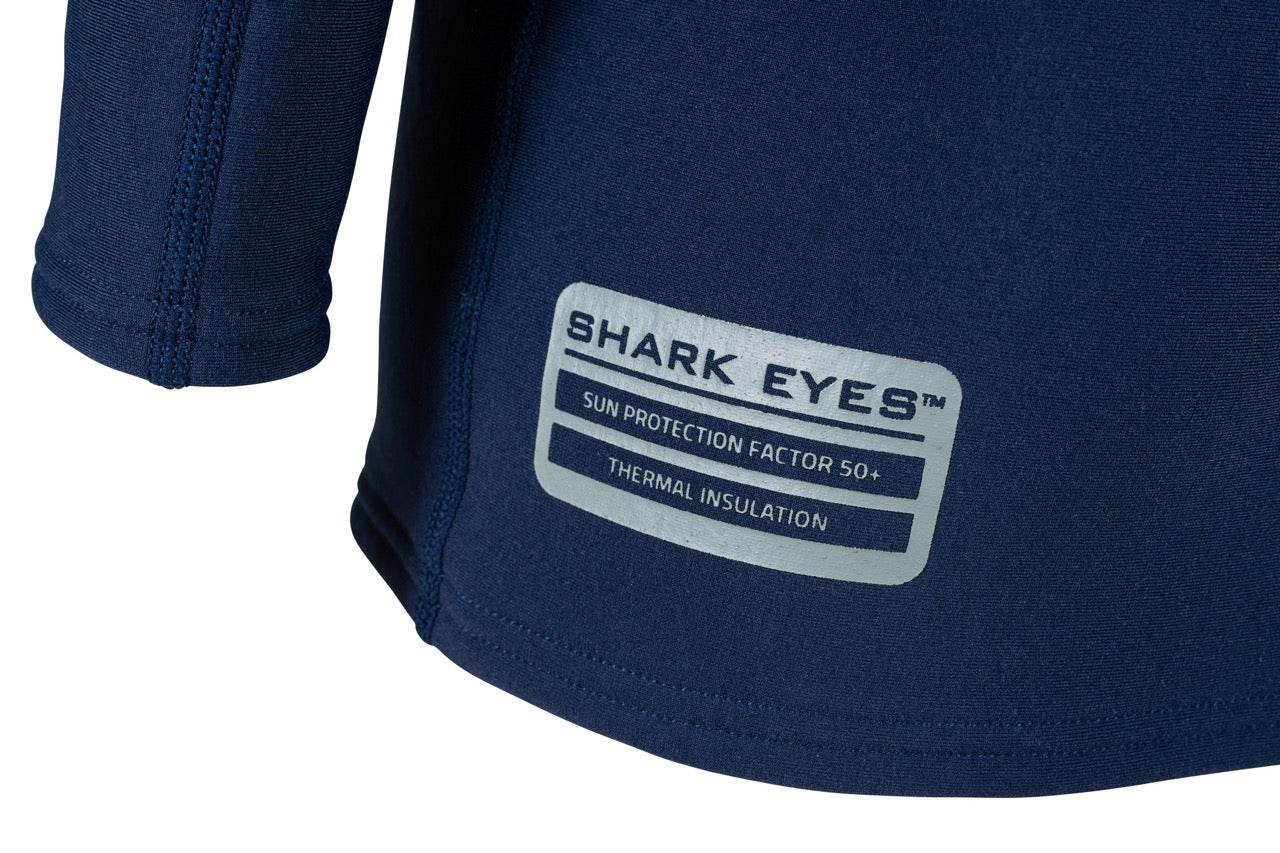 Shark Eyes youth thermal rash vest in use — cold water surfing rashie